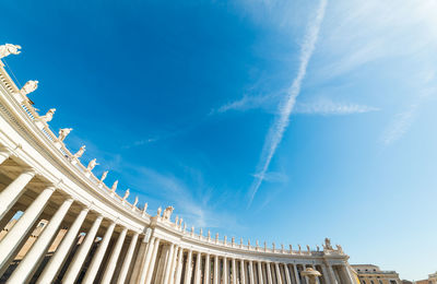 Low angle view of building against cloudy sky
