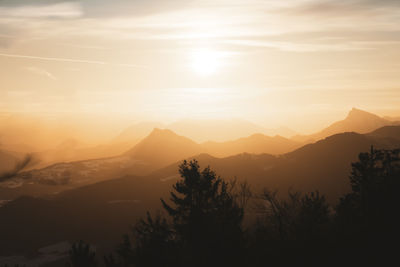 Scenic view of silhouette mountains against sky during sunset