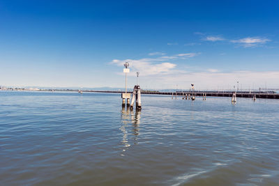 Scenic view of sea against blue sky