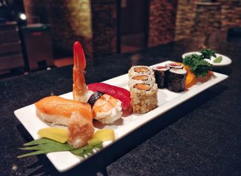 Close-up of sushi served on table