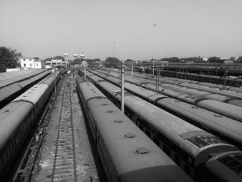 High angle view of trains on railroad tracks against clear sky
