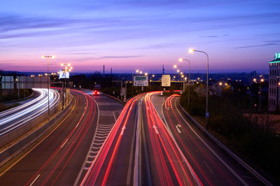 High angle view of light trails on road at night