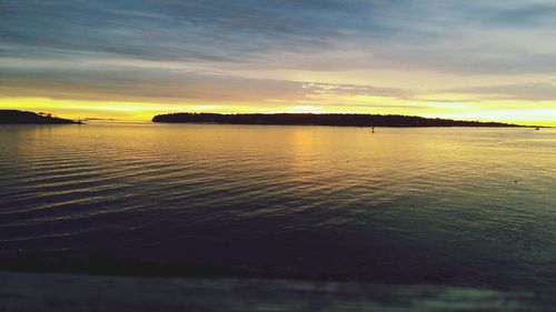 Scenic view of sea at sunset