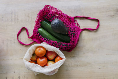 Eco friendly and reusable shopping mesh bag with fruits and vegetables