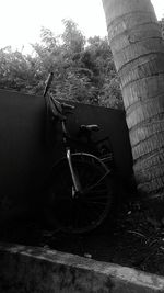 Bicycle leaning on wall