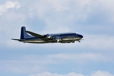 Low angle view of airplane flying in sky