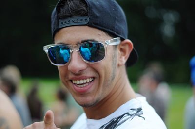 Portrait of smiling young man wearing sunglasses