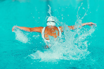 Female athlete swimming in pool