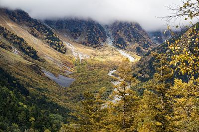 Scenic view of mountains against sky during autumn