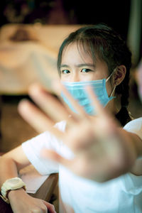 Portrait of boy holding camera