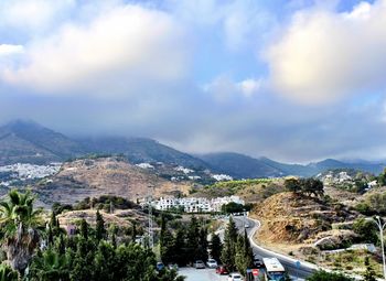 High angle view of buildings in city against sky