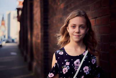 Portrait of smiling girl standing outdoors