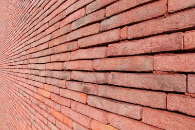 Full frame shot of red brick wall