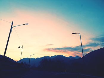 Street against sky during sunset