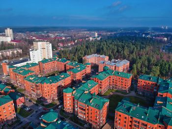 High angle view of buildings in city against sky