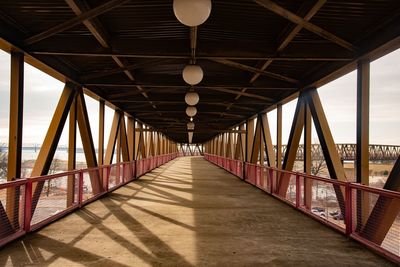 Empty footbridge in water