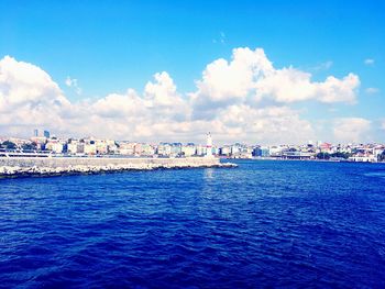 Panoramic view of sea against blue sky