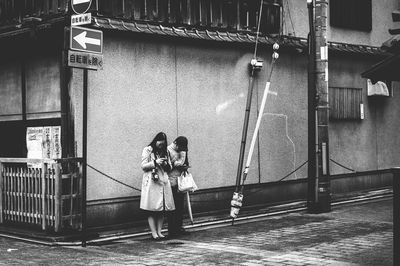 Rear view of woman photographing