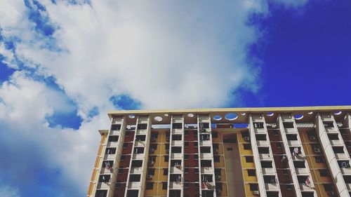 Low angle view of building against blue sky