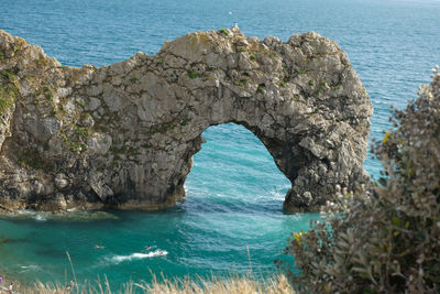 Scenic view of rock formation in sea