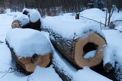 High angle view of snow covered trees on field