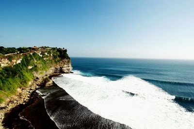 Scenic view of sea against clear blue sky