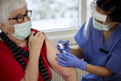 Senior woman getting covid vaccine