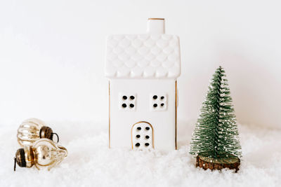 Close-up of christmas decorations against white background