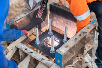Midsection of man working at workshop