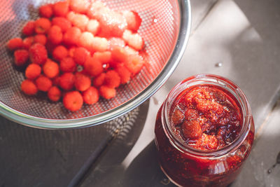 Making homemade jam from picked wild strawberries