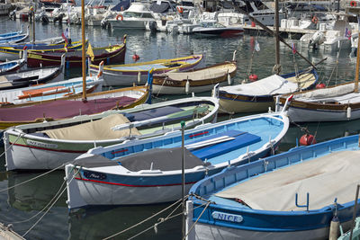 High angle view of boats moored at harbor