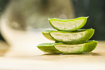 Close-up of green bananas on table