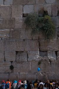 People on wall