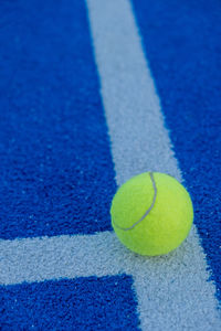 Close-up of tennis ball on playing field