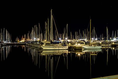 Boats moored at harbor