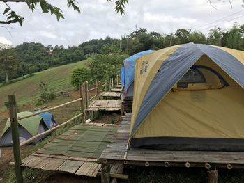 Tent on field against sky