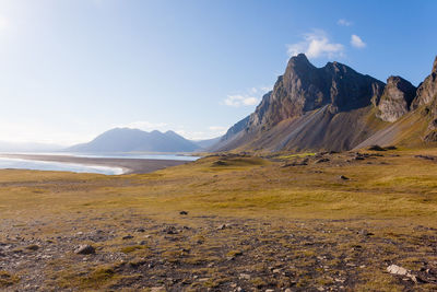 Scenic view of landscape and mountains against sky