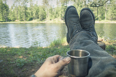 Low section of man legs in lake