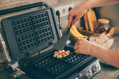 Cropped hands of man preparing food