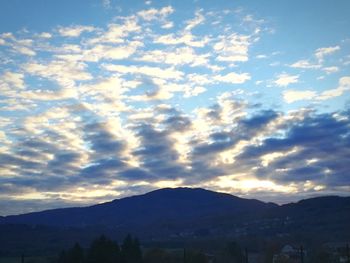 Scenic view of silhouette mountains against sky