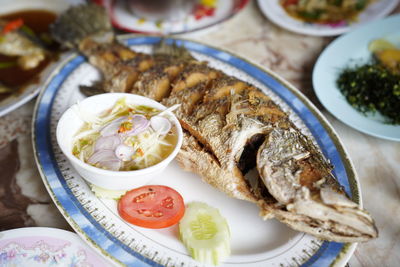 Close-up of fish served on table