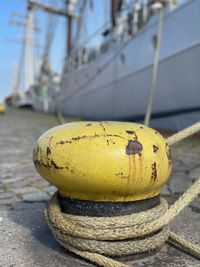 Close-up of yellow rope on boat at harbor