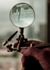 Close-up of hand holding camera