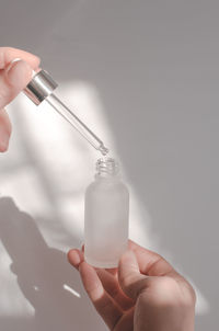 Cropped hand holding syringe