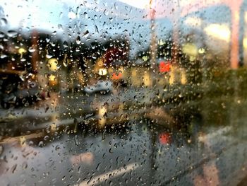 Full frame shot of wet glass window in rainy season