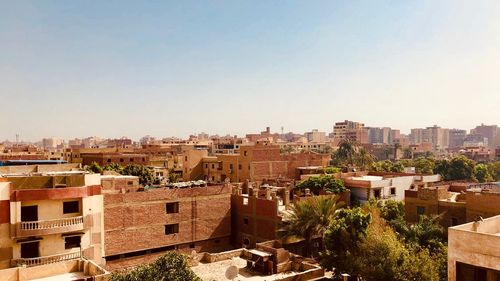 High angle view of buildings against clear sky