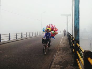 Man cycling on road