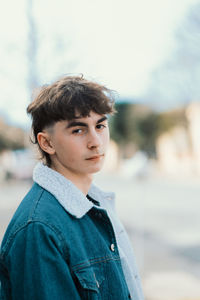 Handsome teenager wearing denim jacket