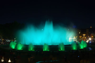 Panoramic view of illuminated city against sky at night