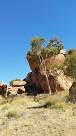 Rock formation against clear blue sky